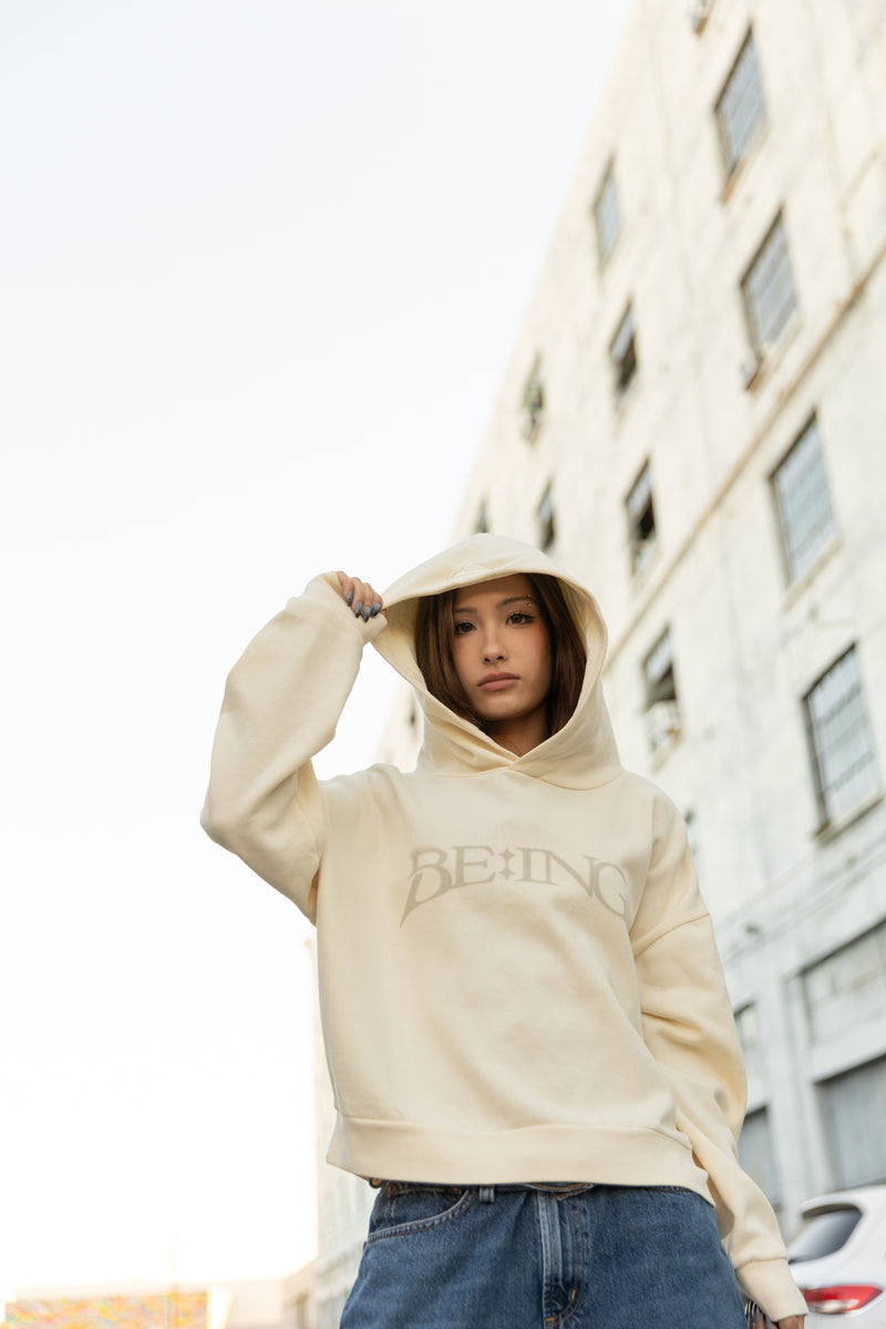 T1 BE:ING Cropped Hoodie - Cream