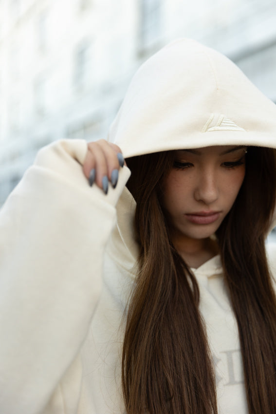 T1 BE:ING Cropped Hoodie - Cream